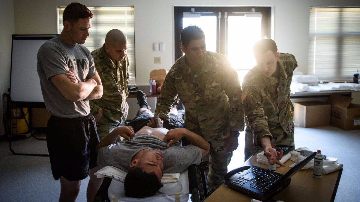 MAJ Jonathan Monti, EMPA, teaches medics in the 82nd Airborne Division how to use ultrasound.