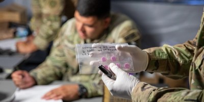Combat Medic preparing medication in Sick Call
