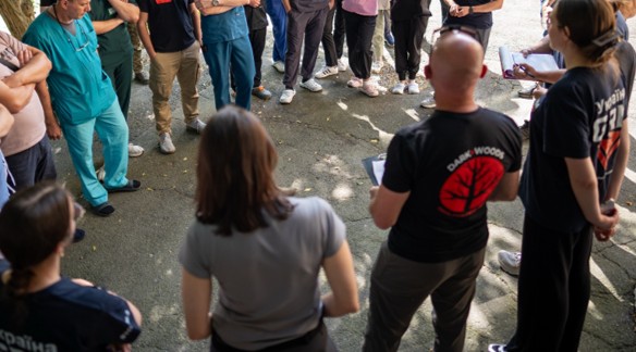 Partner Nation Surgical Team Personnel are briefed on roles and responsibilities for a surgical team simulation Global Response Medicine STRORM-2  Course Photo Credit Spencer Chumbley 2026